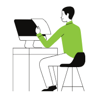 man sitting in front of computer while holding a piece of paper